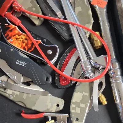 Assortment of hand tools and folding pocket knives, including digital camo handles, a Project Source utility knife, pneumatic blow guns,...