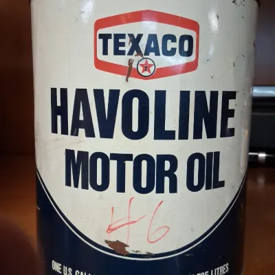Vintage Texaco Havoline one U.S. gallon motor oil tin showing minor surface rust, scratches, and handwritten markings.
