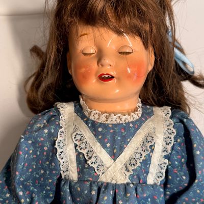 Sale Photo Thumbnail #390: Hair, extra clothes shown were original items when doll was bought. 
Eyes open when upright closed when laying down.