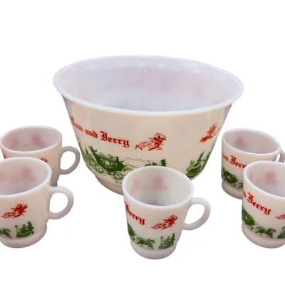Sale Photo Thumbnail #40: Vintage Hazel-Atlas 'Tom and Jerry' milk glass punch set, including a large mixing bowl and five matching handled mugs with red and green holiday graphics.