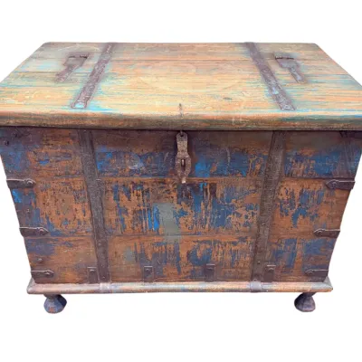 Sale Photo Thumbnail #32: Rustic antique wooden storage chest with iron hardware, featuring a weathered blue paint finish and carved bun feet.