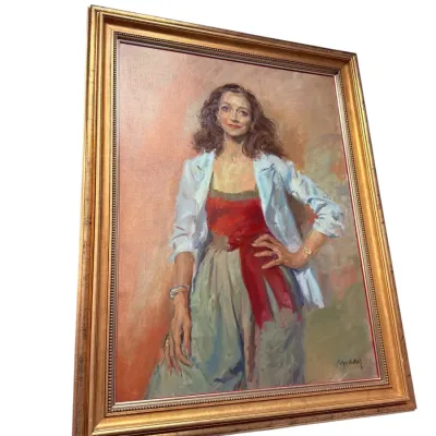 Sale Photo Thumbnail #25: Framed oil painting portrait of a smiling woman in a light jacket, signed by the artist in the lower right corner and set in a molded gold-tone frame.