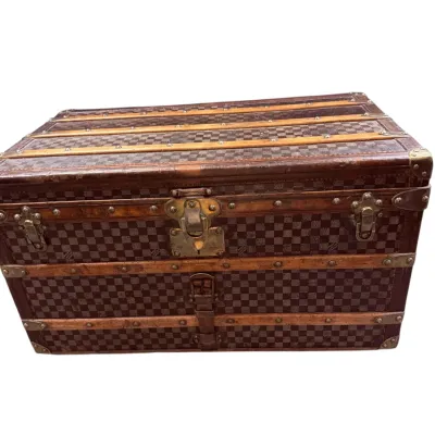Sale Photo Thumbnail #21: Antique Louis Vuitton Damier canvas steamer trunk featuring wood slats, brass latches, and studded trim with age-appropriate wear.