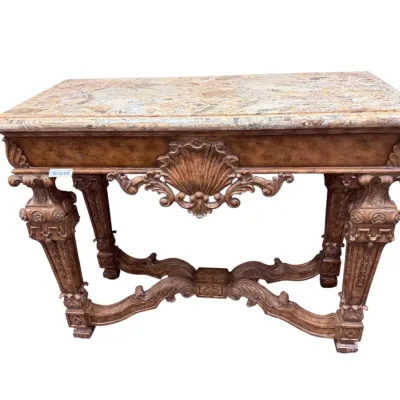 Sale Photo Thumbnail #24: Ornate Baroque-style console table featuring an intricately carved base with shell motif accents, heavily detailed legs, and a faux-marble inlay top.