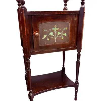 Sale Photo Thumbnail #34: Antique wooden washstand featuring a hand-painted floral design on the cabinet door, turned legs, and a bottom shelf.