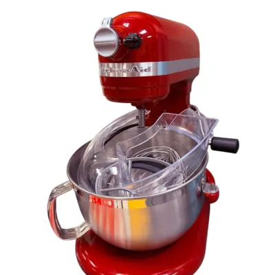 Sale Photo Thumbnail #12: Red KitchenAid bowl-lift stand mixer, complete with stainless steel bowl, clear pour shield, and mixing attachments.