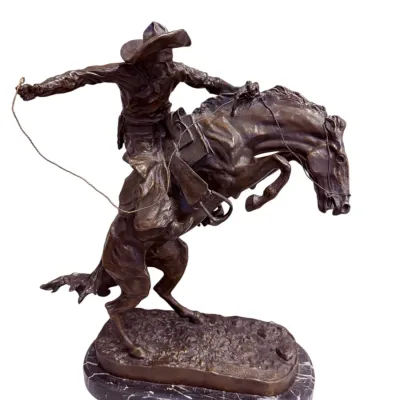 Sale Photo Thumbnail #6: Bronze sculpture after Frederic Remington titled 'The Bronco Buster', depicting a cowboy riding a bucking horse, mounted on a dark marble base.