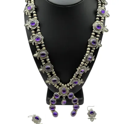 Sale Photo Thumbnail #9: Native American style squash blossom necklace and matching drop earrings set, crafted in sterling silver with purple cabochon stones.