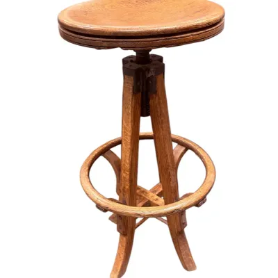 Sale Photo Thumbnail #29: Antique wooden adjustable swivel stool with a round seat and cast iron screw mechanism, early 20th century.