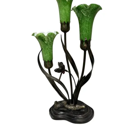 Sale Photo Thumbnail #51: Art Nouveau-style three-light lily table lamp featuring green slag glass trumpet shades and a dark bronze finish base with dragonfly accent.