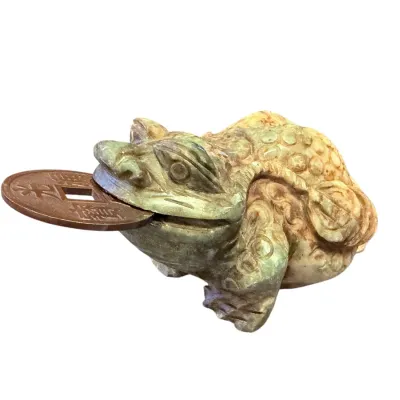 Sale Photo Thumbnail #53: Hand-carved green soapstone money toad figurine holding a Chinese coin in its mouth, symbol of wealth and good fortune.