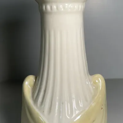 Sale Photo Thumbnail #34: Vintage Lenox glazed ceramic vase featuring a fluted column design on an iridescent pale yellow base.