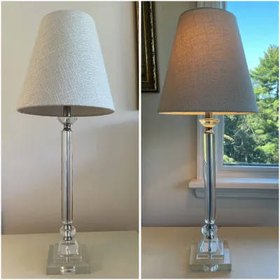 Sale Photo Thumbnail #8: Contemporary clear acrylic column table lamp with silver-tone hardware and a linen-textured beige shade, shown unlit and illuminated.