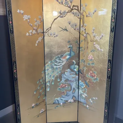 Sale Photo Thumbnail #72: Three-panel Asian floor screen featuring a gold leaf background with hand-painted peacocks, cherry blossoms, and floral accents set in a decorative black frame.