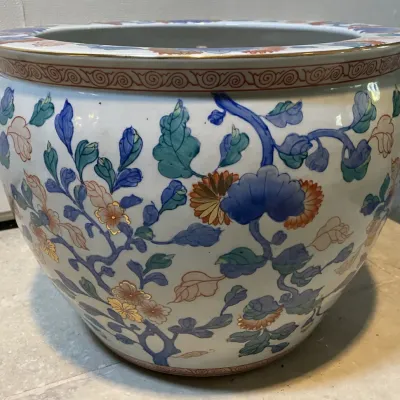 Sale Photo Thumbnail #41: Large Chinese porcelain fish bowl planter with hand-painted floral and vine motifs, featuring gilded accents and a geometric band along the rim.