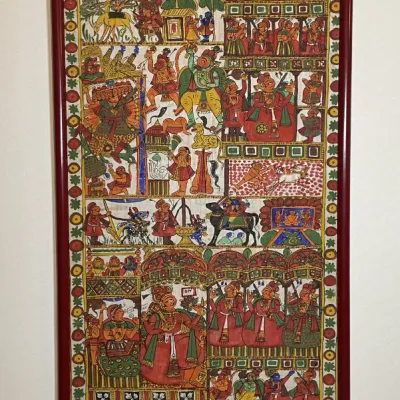 Sale Photo Thumbnail #46: Framed Indian Phad scroll painting featuring intricate narrative panels depicting deity Lord Ganesha, mythological figures, and traditional royal processions. Presented in a dark reddish-brown wooden frame.