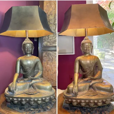 Sale Photo Thumbnail #20: Vintage bronze-finish seated Buddha table lamp paired with a black bell shade featuring a metallic gold lining, shown lit and unlit.