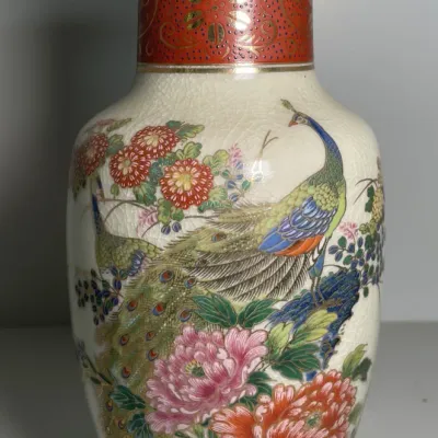 Sale Photo Thumbnail #33: Vintage Japanese Satsuma-style crackle glaze porcelain vase featuring colorful peacocks and floral motifs with gilt accents.