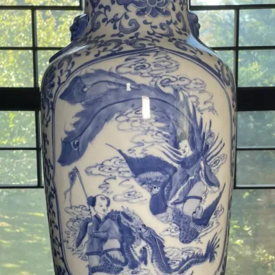 Sale Photo Thumbnail #30: Large blue and white porcelain floor vase featuring hand-painted panels depicting figures, dragons, and clouds with ornate floral scroll borders.