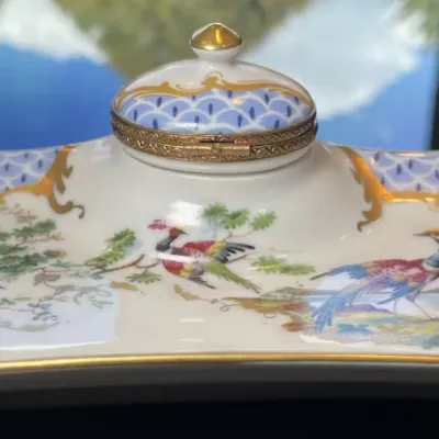 Sale Photo Thumbnail #25: Hand-painted porcelain desk inkwell stand featuring bird motifs, a blue fishscale pattern, and gilt trim.