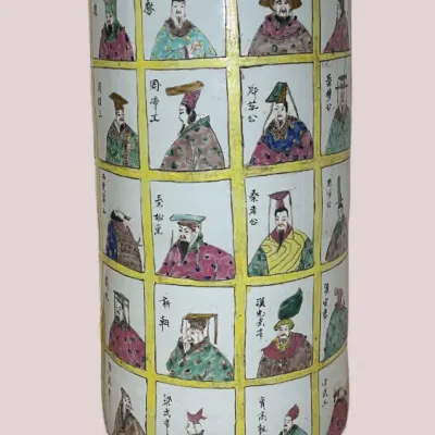 Sale Photo Thumbnail #42: Large Chinese Famille Verte style porcelain vase featuring a grid of hand-painted figures and dragon motifs on the neck, resting on a carved wooden base.