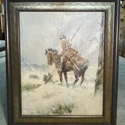 Sale Photo Thumbnail #48: Framed oil painting depicting a mounted soldier in a snowy landscape, signed by J. Kossak and dated 1928, set in a metallic composite dark wood frame.