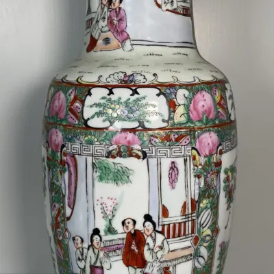 Sale Photo Thumbnail #37: Chinese Rose Medallion porcelain vase with hand-painted court scenes, floral panels, and gilt trim along the flared rim.