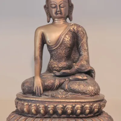 Sale Photo Thumbnail #11: Cast metal seated Buddha statue in the Bhumisparsha mudra position with ornate floral engraved robes and a tiered lotus base.