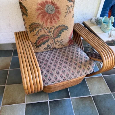 Sale Photo Thumbnail #82: Vintage Paul Frankl style multi-strand rattan arm chair with floral tapestry seat and back cushions.