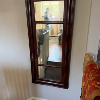 Sale Photo Thumbnail #133: Tall rectangular wall mirror featuring a dark mahogany-finished wooden frame with multi-pane divider accents.
