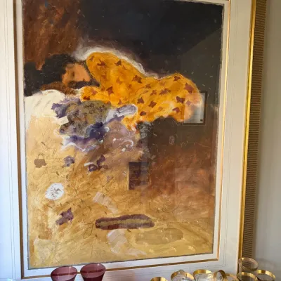 Sale Photo Thumbnail #191: Large framed contemporary art print depicting a sleeping figure, presented in an ornate textured gold frame.