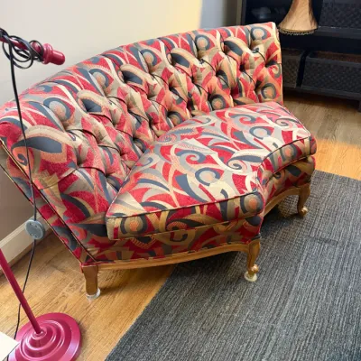 Sale Photo Thumbnail #126: Tufted, curved small sofa with abstract red, grey, and beige patterned upholstery and cabriole legs.