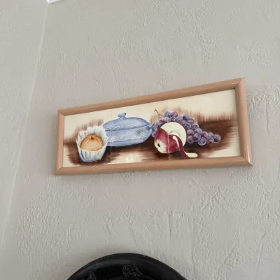 Sale Photo Thumbnail #116: Framed three-tile ceramic wall art panel featuring a hand-painted still life of fruit and a tureen.