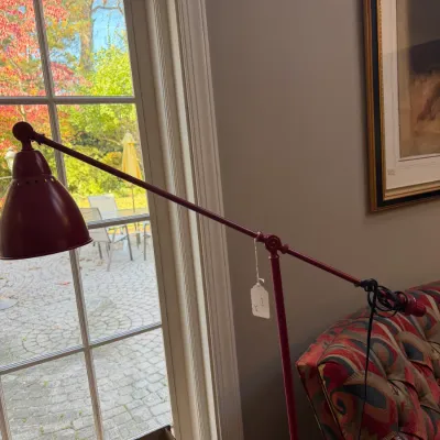 Sale Photo Thumbnail #127: Modern red metal adjustable boom arm floor lamp featuring a dome shade and counterweight design.