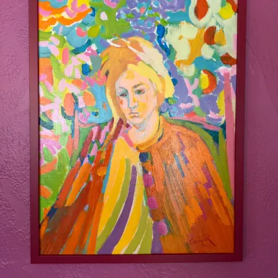 Sale Photo Thumbnail #113: Fauvist-style expressionist portrait oil painting depicting a figure in a colorful landscape, signed lower right and set in a maroon frame.