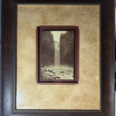 Framed vintage photograph of Taughannock Falls, set in a shadowbox-style double mat within a textured dark wood frame.