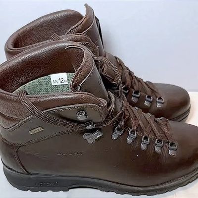 Pair of men's brown leather L.L. Bean Gore-Tex hiking boots, size 12M, featuring metal D-ring lacing hardware and Vibram soles.