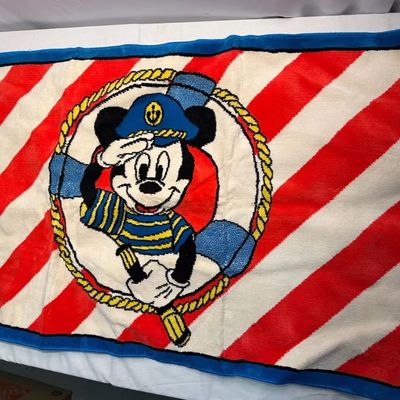 Vintage Disney Mickey Mouse nautical towel featuring a sailor Mickey graphic on a red and white diagonal striped background with a blue...
