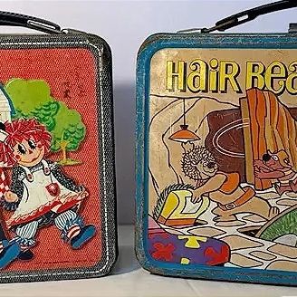 Pair of vintage 1970s metal lunchboxes, featuring Raggedy Ann and Andy and Hanna-Barbera's Hair Bear Bunch graphics, showing light...