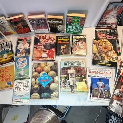 Large collection of vintage Boston sports books, magazines, and programs, focusing primarily on the Boston Red Sox and Boston Celtics.