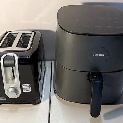 Black+Decker two-slice toaster alongside a matte black Cosori digital air fryer, both in good, clean condition.