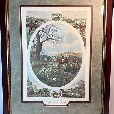Framed vintage fox hunting print titled "A Day with the Harriers," featuring an equestrian landscape scene enclosed in a dark...