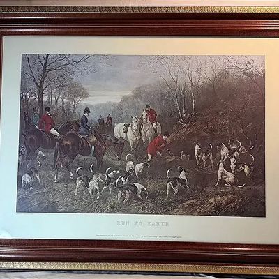 Framed traditional fox hunting art print titled "Run To Earth," set in an ornate mahogany-toned and gold decorative frame with...