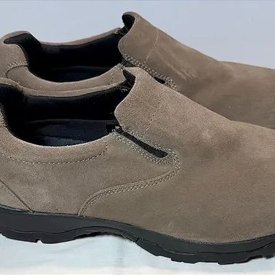 Pair of Merrell suede slip-on shoes in taupe brown with black rubber soles, in gently used condition.