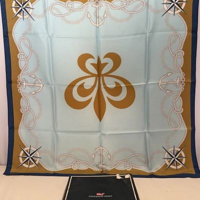 Vineyard Vines nautical themed square silk scarf with light blue and gold geometric and anchor motifs, shown with its original box.