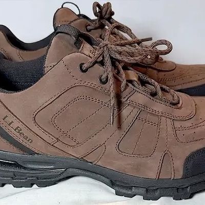 Pair of men's L.L. Bean brown leather trail hiking shoes in good pre-owned condition.