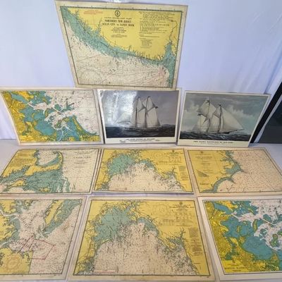Collection of vintage nautical charts and maritime prints featuring coastal regions such as Boston Harbor, Cape Cod, and Chesapeake Bay.