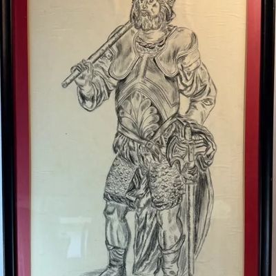 Framed charcoal drawing depicting a bearded medieval warrior in armor, presented with a red mat and black frame.