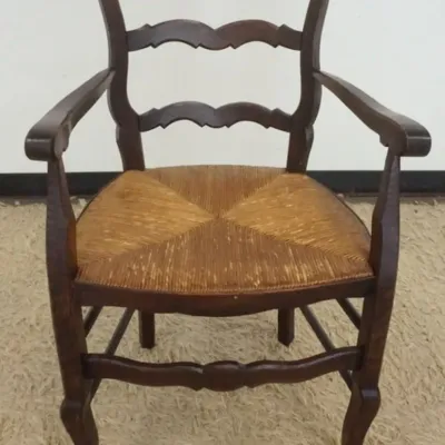 Sale Photo Thumbnail #197: 1196	FRENCH COUNTRY RUSH SEAT ARMCHAIR W/BASKET CARVED CREST, APPROXIMATELY 23 IN X 20 IN X 3 IN HIGH																																																																																																																																																										
