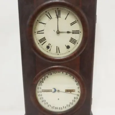 Sale Photo Thumbnail #131: 1131	SETH THOMAS CALENDAR CLOCK, APPROXIMATELY 5 IN X 14 IN X 27 IN HIGH																																																																																																																																																																																							